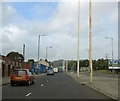 Flagpoles in central reservation opposite Hillsborough.