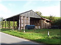 Round straw bales in open barn, Haughs of Ashogle