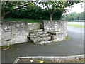 SJ1860 : Mounting block outside Llanferres Church by Eirian Evans