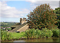 Canalside house with rowan tree near Marple, Stockport