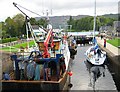 Fishing boats descending the locks