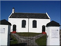 NR1652 : Church at the head of the harbour, Portnahaven by Lesley Smith