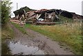 Dead fox and collapsed barn