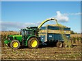 H9250 : A slight overspill as the maize is transferred from the forage harvester to the trailer by P Flannagan