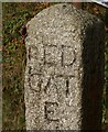 Red Admiral on stone signpost