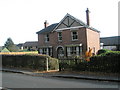 Detached house on southern boundary of grid square in Brook Lane