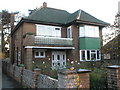 Green tiled house in London Road