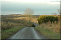 Country road descending into the valley of the river Deveron