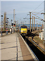 The 14:03 National Express to London arriving on platform 1