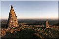 Cairn and trig point on top of West Mains Hill