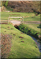 Stream with bridge at Shapridge