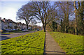 Footway along Houndsden Road, London, N21, looking west.