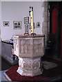 TL9997 : St Peter's church - baptismal font by Evelyn Simak