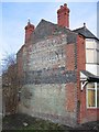 Faded advertising on house