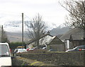 SH5563 : Craig y Dinas with a snowy Snowdon in the background on Easter Day. by Eric Jones