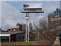 Poster on stilts by elevated motorway