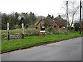 The stocks and village sign