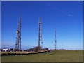 SO9924 : Masts and Car Park on Cleeve Hill by Ian Hunter