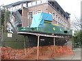 Small boat undergoing renovation at Chichester Canal Basin