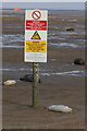 TF4399 : Warning sign and grey seals at Donna Nook by Rob Bradford