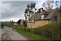 Storm clouds over cottages on Stanway hill