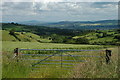 Gate to a field with a view of The Wrekin