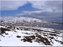 NH3983 : Peat-hags and snow near Crom Loch by Andrew Spenceley
