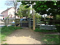 Gateway and bench on the edge of North Meadow Common