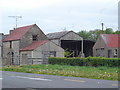 G9680 : Farm buildings by the N15 by Kay Atherton