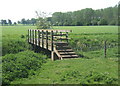 Footbridge crossing the infant Little Ouse from Norfolk into Suffolk