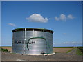 TF4752 : Water Storage Tank and Track Across Outer Marsh by Ian Paterson