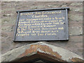 Sign above the almshouses, Bromyard