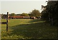 Looking across a field to Battleswick Farm