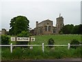 Village sign and St Mary & Helena Parish Church, Elstow