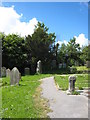 Standing stone and ancient cross in Mabe churchyard