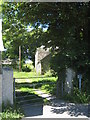 Footpath through Trebarvah Goodnow farmyard