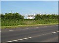 House at Jordanston seen through a gate on the A477