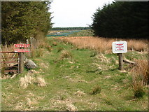 NS7039 : Gap in forest block with gamekeeping signs by Thomas Dick