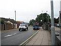 The 21 bus stops by the prison in Milton Road