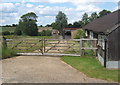 Gateway to fields by outbuildings of Dallinghoo Hall