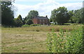 A house set back from the lane at All Saints South Elmham