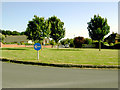 Grassy roundabout across The Heights, Findon Valley