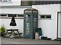 Blue phone box in the car park of the Dial Inn