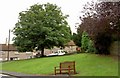 Bench and green High Street Whitwell