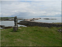 NM4883 : Isle of Eigg: commemorative stone and pier by Chris Downer