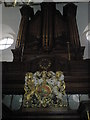 Coat of arms below organ within St Margaret Pattens