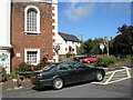 Car passing junction of West Street and Castle Hill