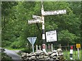 NY2413 : Old road sign at Seatoller Bridge by trevor willis