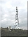 SH5174 : Triangulation pillar and telecommunications mast at Penmynydd by Eric Jones