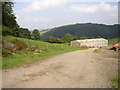 Farm building on edge of hill